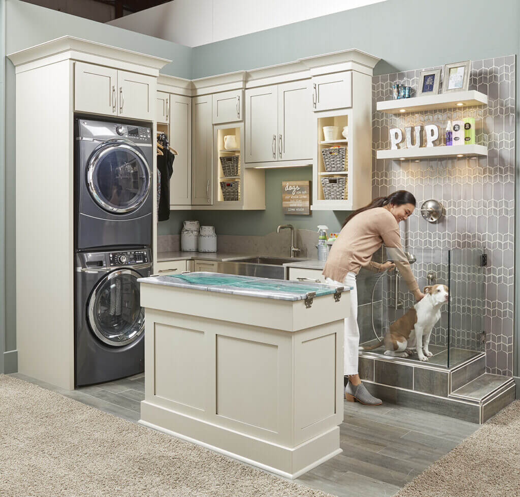 standard overlay cabinets in laundry room with pet bath and island
